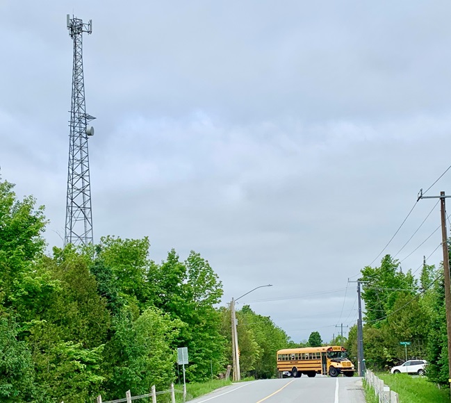 School bus turning near cell tower
